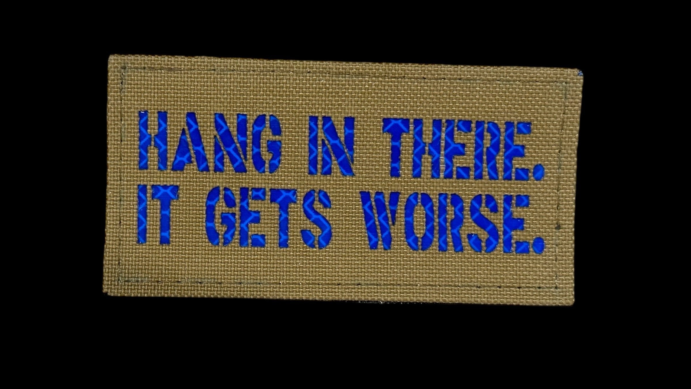Hang In There It Gets Worse quote patch, 3.5x2 inch, dark humor motivational, velcro backed